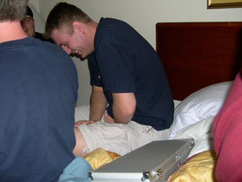1997 Ford Probe - Three people are on a bed, with one man laughing and looking down.