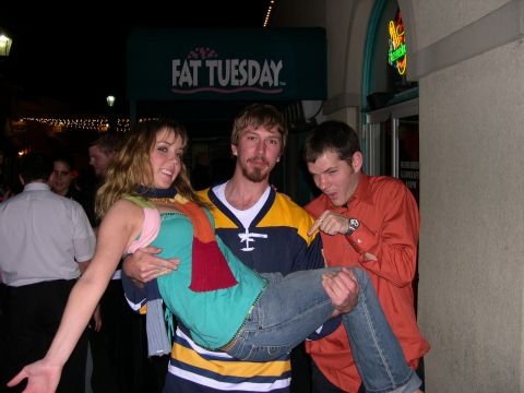 1997 Ford Probe - Three friends pose for a photo outside a Fat Tuesday establishment at night.