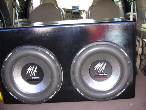 2000 Ford Excursion - A custom enclosure housing two MA Audio subwoofers is visible in the rear of a vehicle.