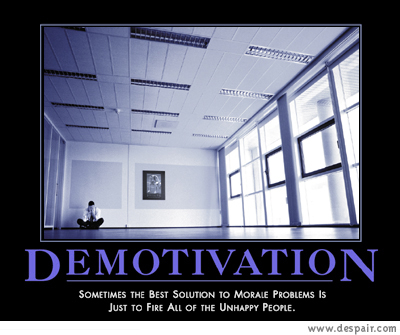 2001 Ford Crown Victoria - A demotivational poster depicts a solitary figure in a vast, empty office space, accompanied by text about morale problems.