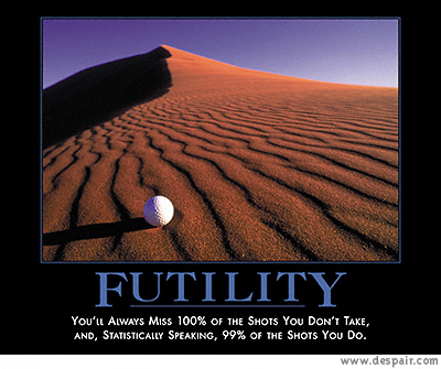 2001 Ford Crown Victoria - A golf ball rests on a vast, windswept sand dune, illustrating the concept of futility.