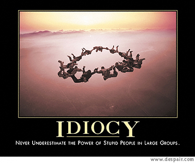 2001 Ford Crown Victoria - A group of skydivers forms a ring in the air, illustrating the concept of idiocy in large groups.