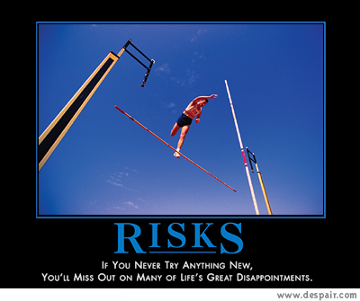 2001 Ford Crown Victoria - A motivational poster with the word RISKS and a quote about trying new things.