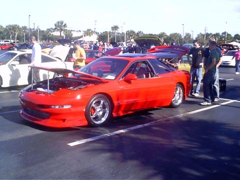 1995 Ford Probe - Red 1995 Ford Probe on display at a car meet, hood is open showing the engine bay.