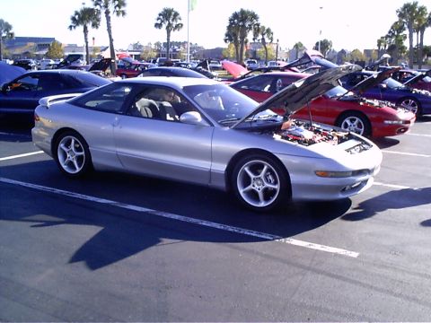 1995 Ford Probe - A silver 1995 Ford Probe is displayed with its hood open at an outdoor car event.