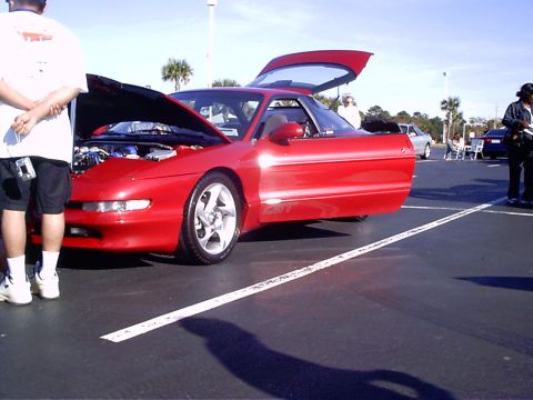 1995 Ford Probe - Red 1995 Ford Probe GT at an outdoor event with doors and hood open.