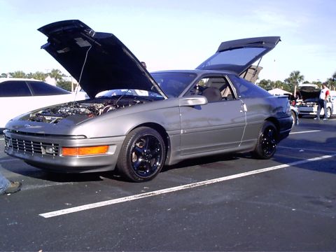 1995 Ford Probe - Gray 1995 Ford Probe at an outdoor car show, hood and trunk open.