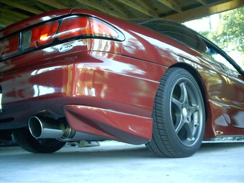 1995 Ford Probe - Rear view of a red 1995 Ford Probe, showing its distinctive taillight and body lines.