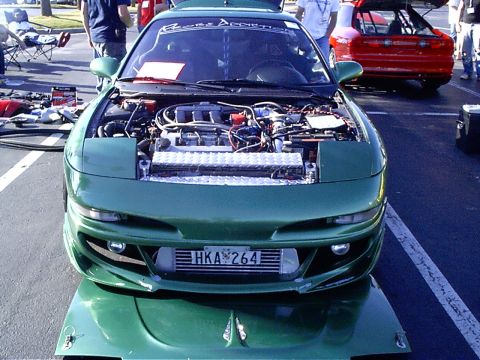 1995 Ford Probe - This 1995 Ford Probe is displayed with its hood open, revealing the engine and an aftermarket intercooler. The license plate reads HKA 264.