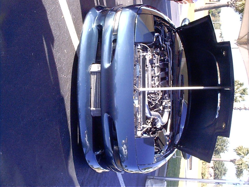 Blue 1995 Ford Probe engine bay with hood open