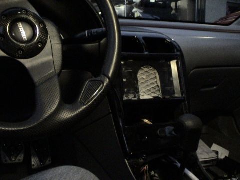 1997 Ford Probe - The interior features a Momo steering wheel and a dashboard with an open slot for a stereo or other components.