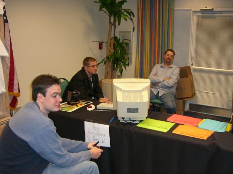 1996 Ford Probe - A registration table is set up with a computer, papers, and three people attending.