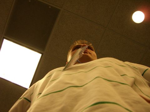 1996 Ford Probe - A person is viewed from below, looking upwards towards the ceiling lights.
