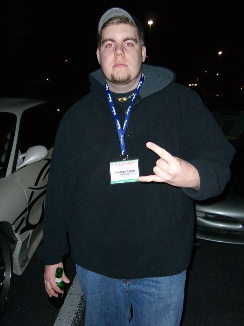 1996 Ford Probe - A man poses for a photo at night, with cars visible in the background.