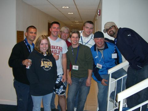 1996 Ford Probe - A group of friends poses for a photo in a hallway, with several individuals wearing lanyards around their necks.