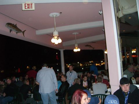1996 Ford Probe - People dine inside a restaurant decorated with fish and an exit sign.