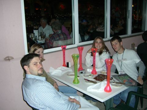1996 Ford Probe - A group of friends enjoys a meal together at a restaurant, with colorful drinkware on the table.