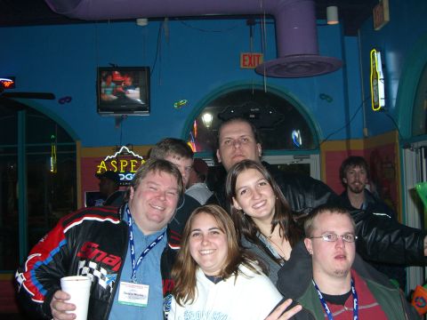 1996 Ford Probe - A group of friends gather for a photo in a brightly lit establishment.
