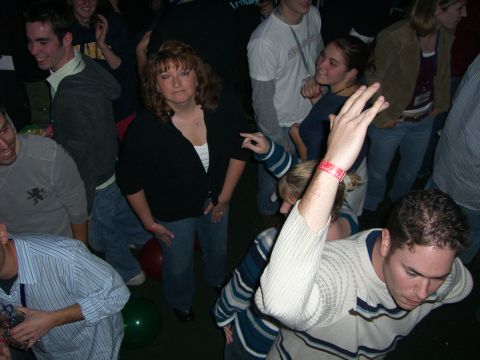 1996 Ford Probe - A group of people are gathered indoors, appearing to be at a social event or party.