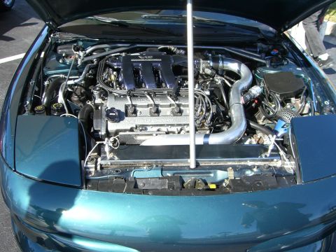 1996 Ford Probe - Engine bay of a 1996 Ford Probe, showing the V6 engine and modified intake.