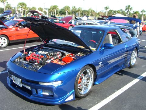 1996 Ford Probe - A modified 1996 Ford Probe GT is displayed with its hood open, revealing a custom engine bay.