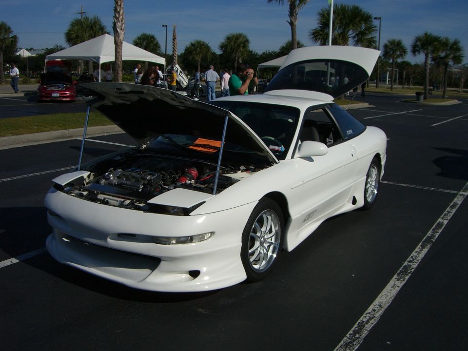 White 1996 Ford Probe with hood and trunk open, showing engine