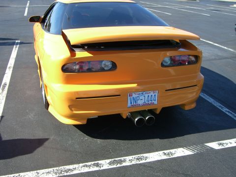 1996 Ford Probe - Rear view of a 1996 Ford Probe, a custom body kit and dual exhaust.