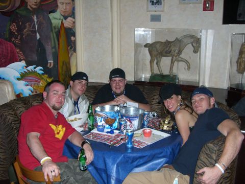 1996 Ford Probe - A group of friends gathers around a table, enjoying drinks and conversation in a uniquely decorated room.