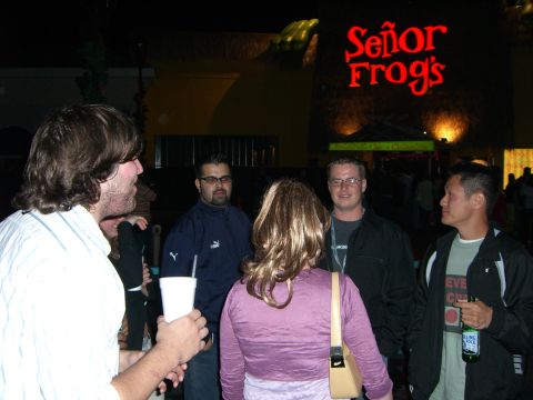 1996 Ford Probe - People gathered outside a Señor Frog's restaurant at night.