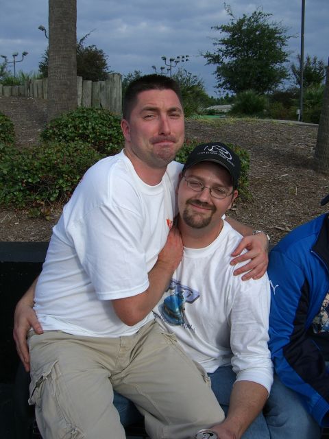 1996 Ford Probe - Two men are pictured together outdoors, with one man's arm around the other's shoulder.
