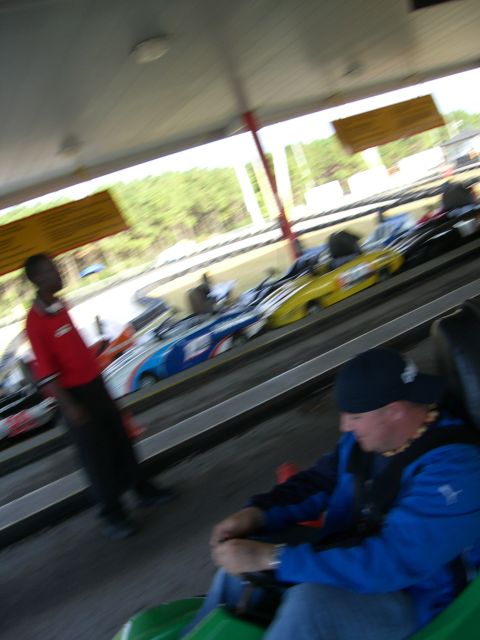 1996 Ford Probe - A line of go-karts are parked, ready for drivers to take them out on the track.