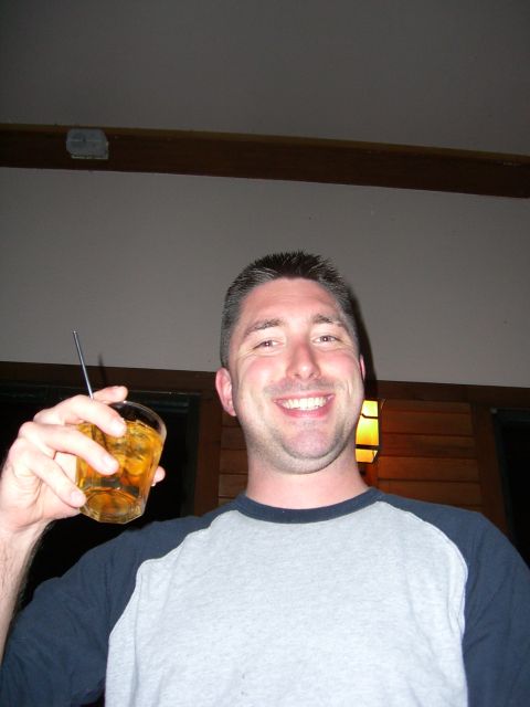 1996 Ford Probe - Man with a drink in his hand, smiling at the camera.