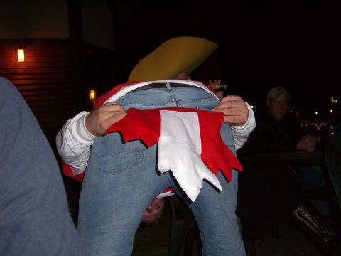 1996 Ford Probe - A person wearing a costume bends over, showing off their jeans and a red and white fabric piece.