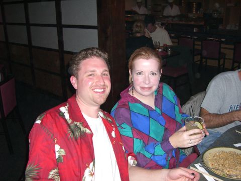 1996 Ford Probe - A couple enjoys a meal together at a restaurant, with food and drinks on the table.