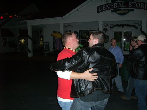 1996 Ford Probe - Two men dancing outside The General Store on Broadway at night.