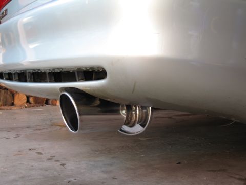 1996 Ford Probe - Dual exhaust tips on a silver car's rear bumper.