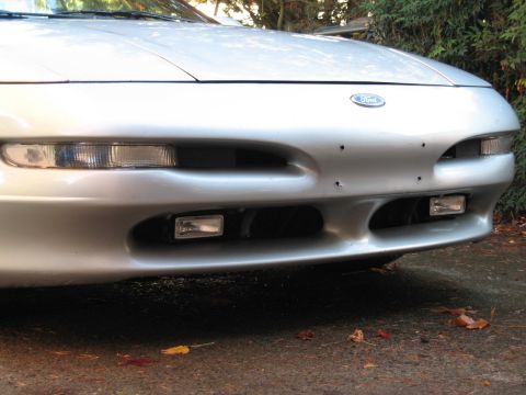 1996 Ford Probe - Front view of a silver Ford Probe, showing its bumper and fog lights.