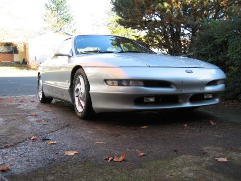 1996 Ford Probe - Front view of a silver 1996 Ford Probe with fog lights and a Ford emblem on the grille.
