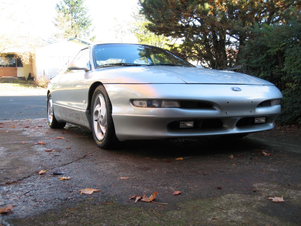 Silver Ford Probe front three-quarter on a leafy driveway with five-spoke wheels