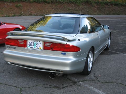 1996 Ford Probe - The rear of a silver 1996 Ford Probe is shown, parked next to a red vehicle.