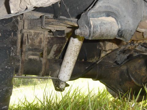 1989 Ford Bronco - Close-up view of the rear suspension components of a vehicle.