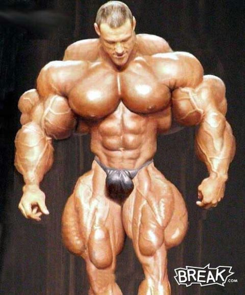 1991 Ford Bronco - Bodybuilder posing on stage, wearing a posing brief. Break.com logo visible.