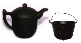 1986 Ford Bronco - A black teapot and a black cauldron are shown side-by-side against a white background.