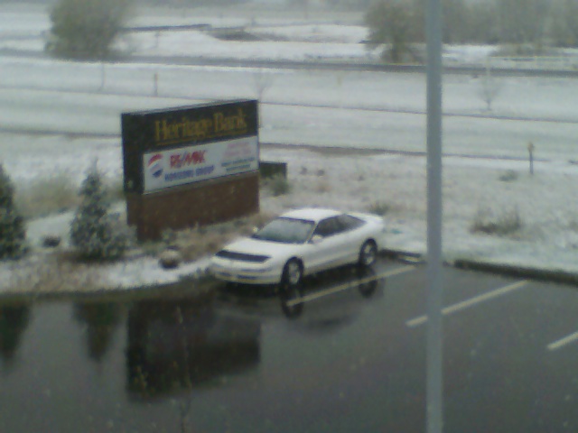 White 1996 Ford Probe parked in a snowy lot