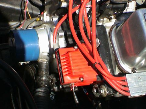 1979 Ford Bronco - The engine's ignition system features an electronic ignition box and red spark plug wires connected to the distributor.