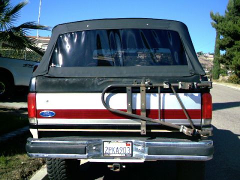 1989 Ford Bronco - This 1989 Ford Bronco features a removable soft top and a rear-mounted spare tire carrier.