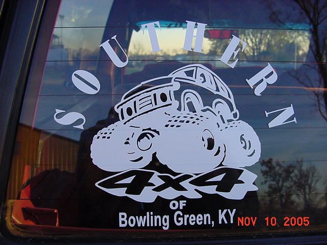 White sticker on rear window shows cartoon 4x4 truck with text 'SOUTHERN 4x4 OF Bowling Green, KY' and 'NOV 10, 2005 SUPERMOTORS'