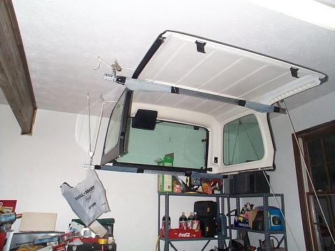 1995 Ford C-350 (Centurion Conversions) - Yeah it's a jeep top but you get the idea we used the angle iron wrapped w/ old pant legs to protect the finish on the bottom of the plasti…