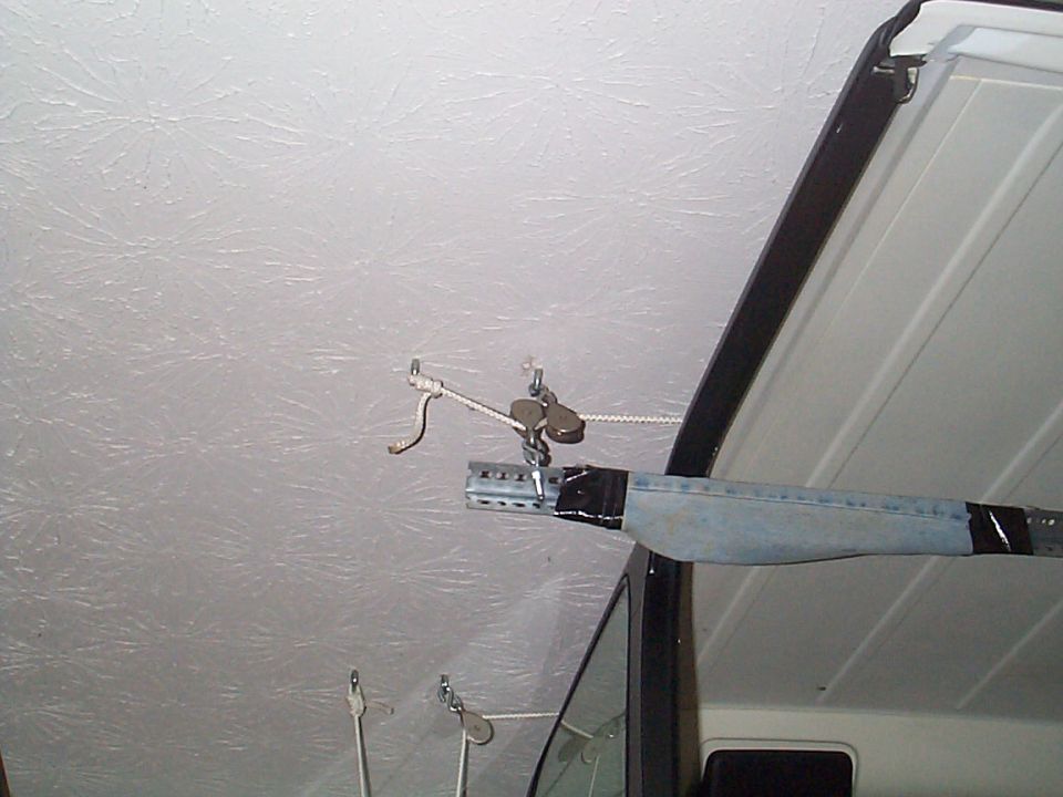 All anchors in the ceiling are directly into the rafters which are 2X10's  

This is the hard anchored side (away from tie down on the wall)