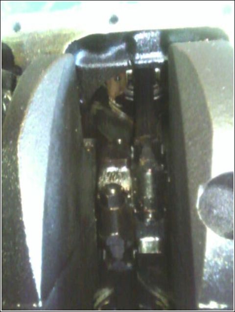 1980 Ford Bronco - Internal engine component detail, likely a piston and rod assembly within a cylinder.